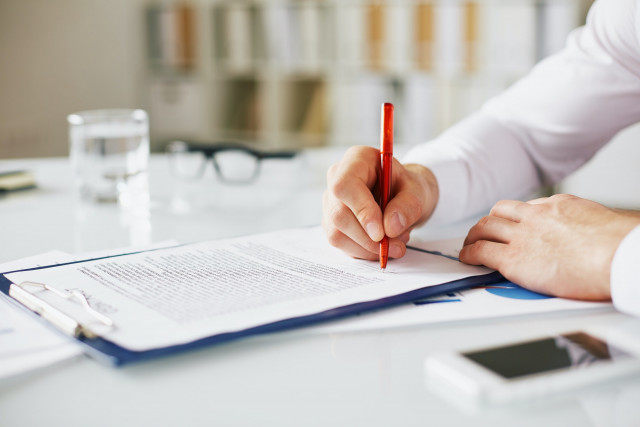 boss signing contract